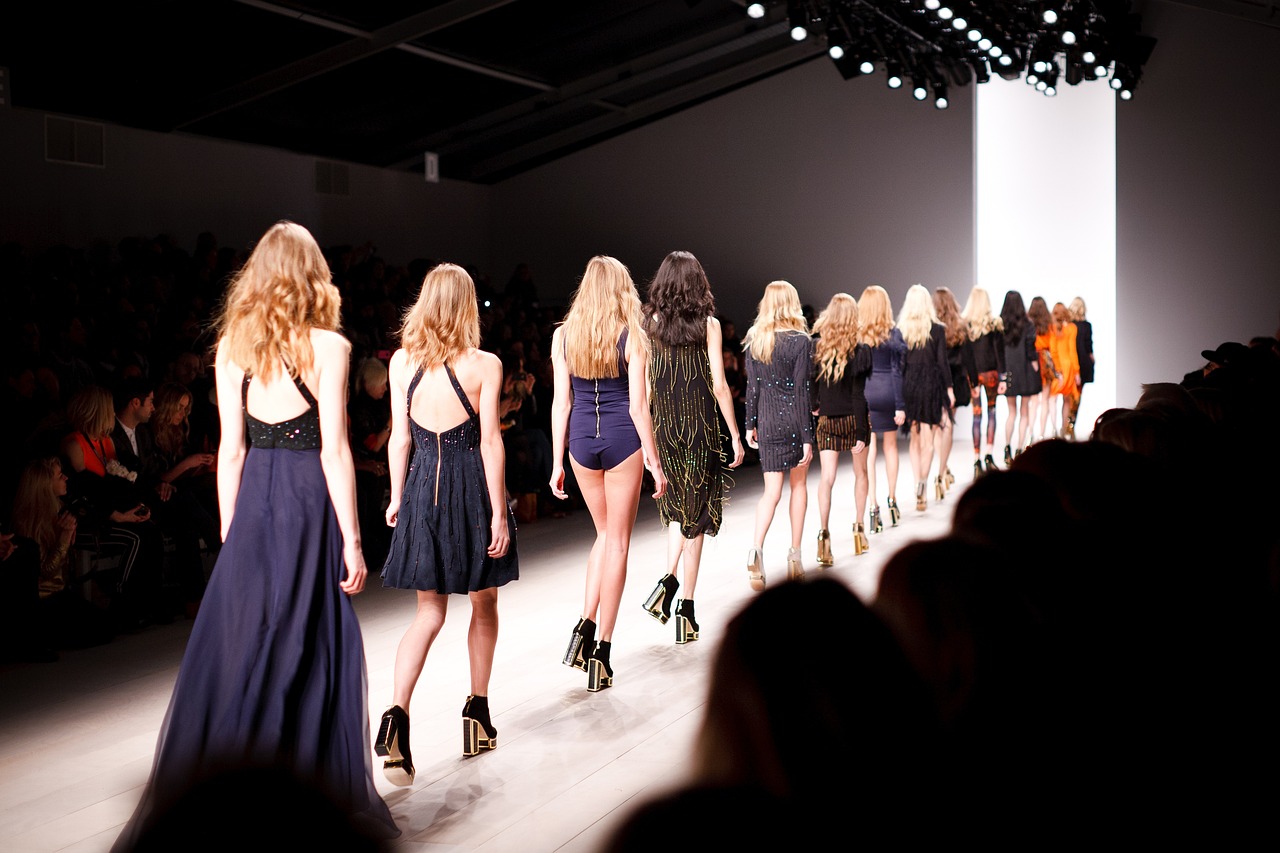women walking in a fashion runway show